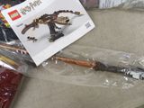 a bag of legos and a toy gun on a table