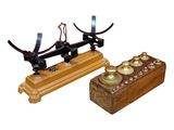 a wooden box and a metal device on a white background