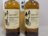two bottles of sake and a box of sake