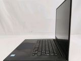 the back of a laptop computer sitting on top of a white table