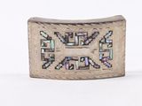 a silver and mother of pearl buckle with a cross on it