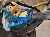 a black bag filled with blue and yellow boxes