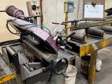 a picture of a machine that is working on a piece of metal