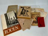 many books on a white table with a red book