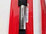 a knife that is laying on top of a red bag