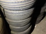 tires stacked on top of each other in a garage
