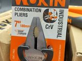 a pair of pliers that are sitting on top of a box
