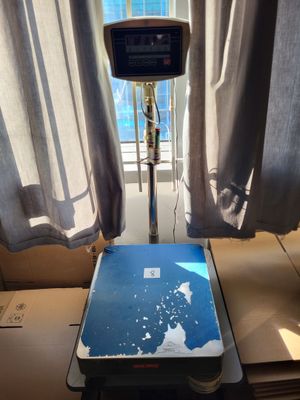 a laptop sitting on a table in front of a window