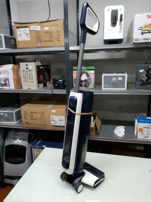 a vacuum that is sitting on a table in a room