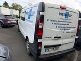 a white van that is parked in a parking lot