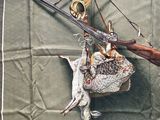 a painting of a bird and a gun hanging on a wall