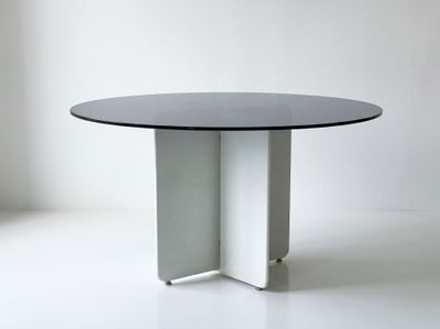 an image of a white table with a black top on a white floor
