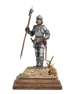 a figurine of a man in armor holding a sword
