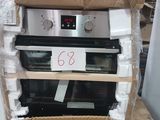 a cardboard box on top of an oven that is in the process of being installed
