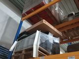 many boxes on the shelves in the warehouse