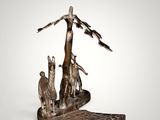 a bronze statue of a woman and two dogs on a rock