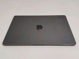 an apple macbook pro laptop sitting on top of a white table