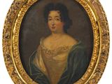 portrait of a lady in a green dress in a gold frame