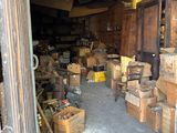 a garage with a lot of boxes and boxes on the floor