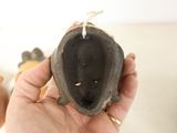 a person holding a small black object in their hand