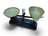 a scale with two bowls on it on a white surface