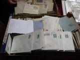 a box full of old letters and papers on a table
