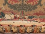 a couch that has a pillow on it with a picture on it
