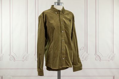 an image of a green shirt on a mannequin stand