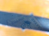 a close up of a yellow bowl with a label on it