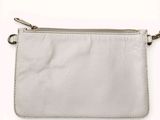 a close up of a white purse on a white background