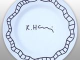 a white plate with a drawing of a snake on it