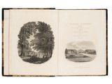 an open book with a picture of a house and trees on it