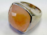 a close up of a ring with a stone in it