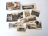 many old photographs of people and buildings on the table