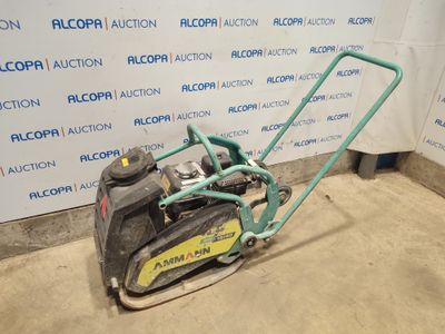 an image of a lawn mower parked in a garage