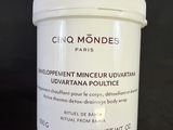 chano mondes body cream in a jar on a black background