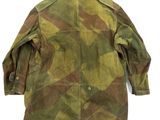 a close up of a military jacket on a white background