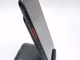a cell phone that is sitting on top of a stand