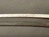 pair of old and worn swords on a black surface