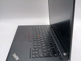 a laptop that is open on a white surface