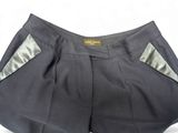 the shorts are black and have silver trims on them