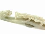a white object that looks like a boat with a dragon on it