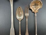 four spoons, a spoon, and a spoon on a table