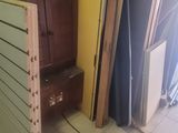 several pieces of wood are stacked on top of each other in a room