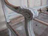 a close up of a bed frame with a wooden headboard