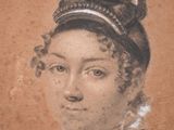 an old picture of a woman with a feathered headband