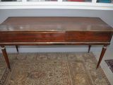 a wooden table with a drawer on top of it
