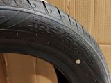 a close up of a tire on a cardboard box with a cardboard box in the background