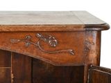 a wooden cabinet with a drawer on top of it