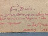 an old envelope with writing on it sitting on a table